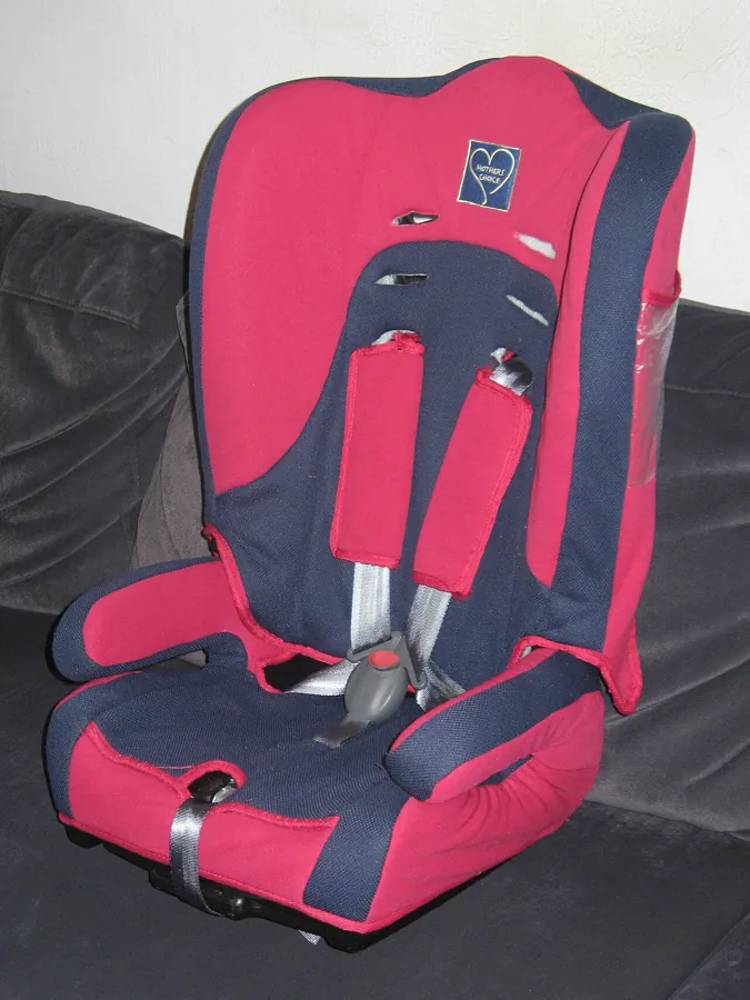 Red and navy child car seat with harness