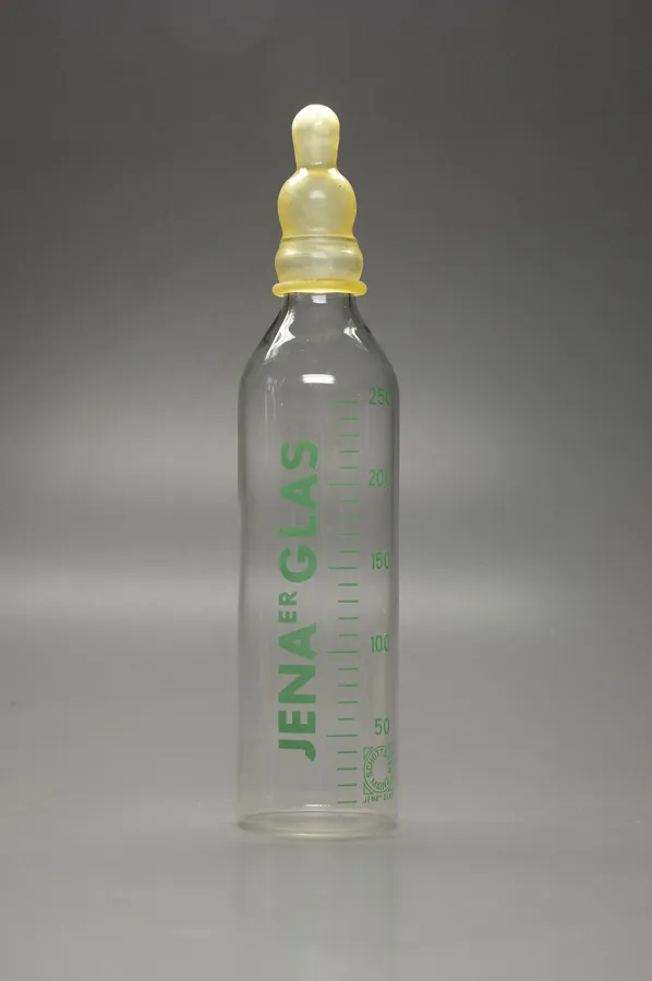 Glass baby bottle with a rubber nipple